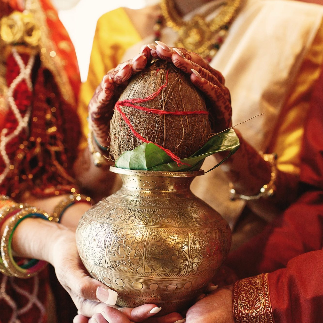 indian-bride-s-parents-hold-bowl-with-coconut-her-hands (2)